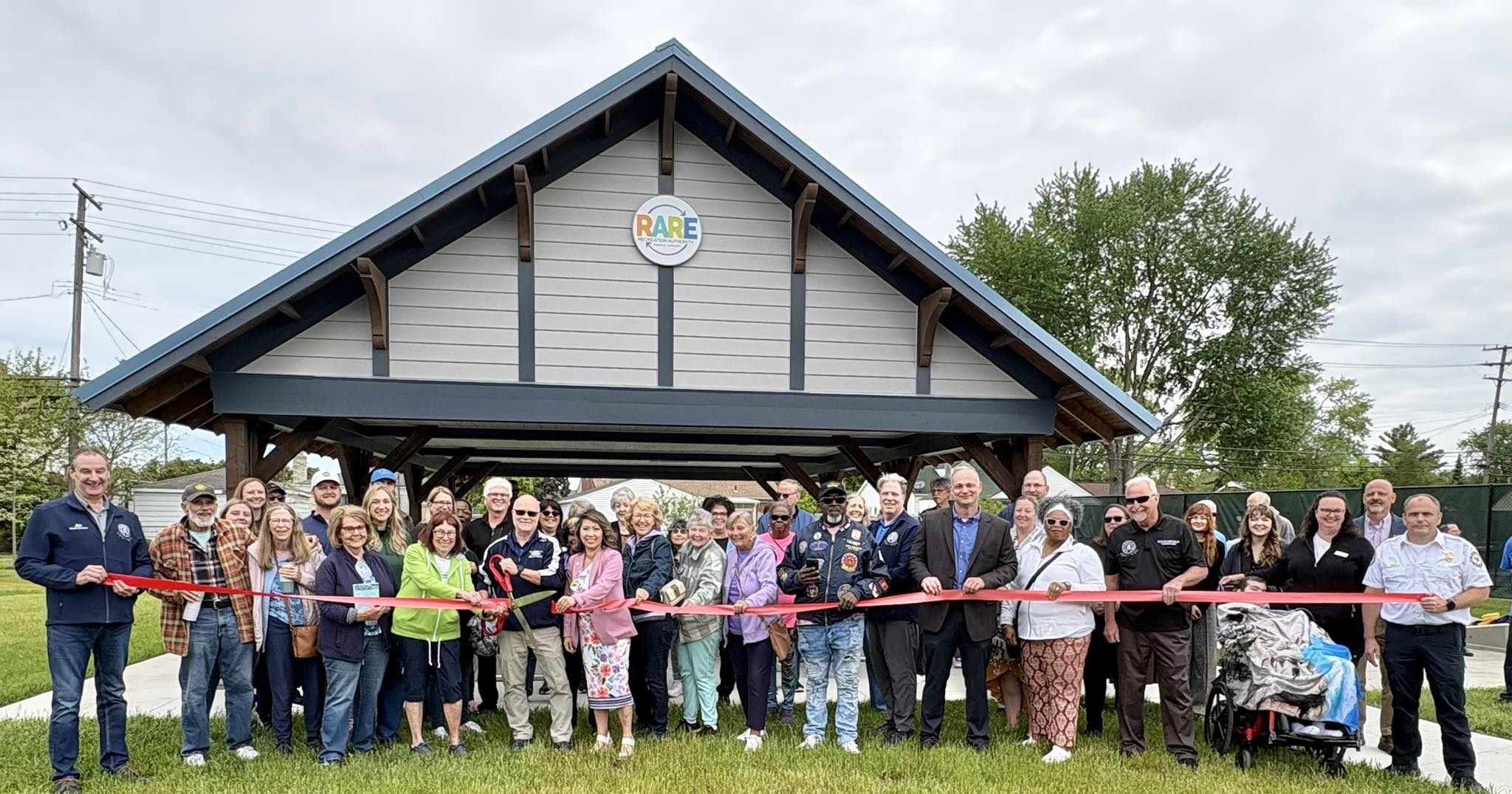 Michigan State Representative Mai Xiong with community leaders and residents at the ribbon cutting ceremony for the newly renovated RARE Park in Roseville on May 20, 2026.