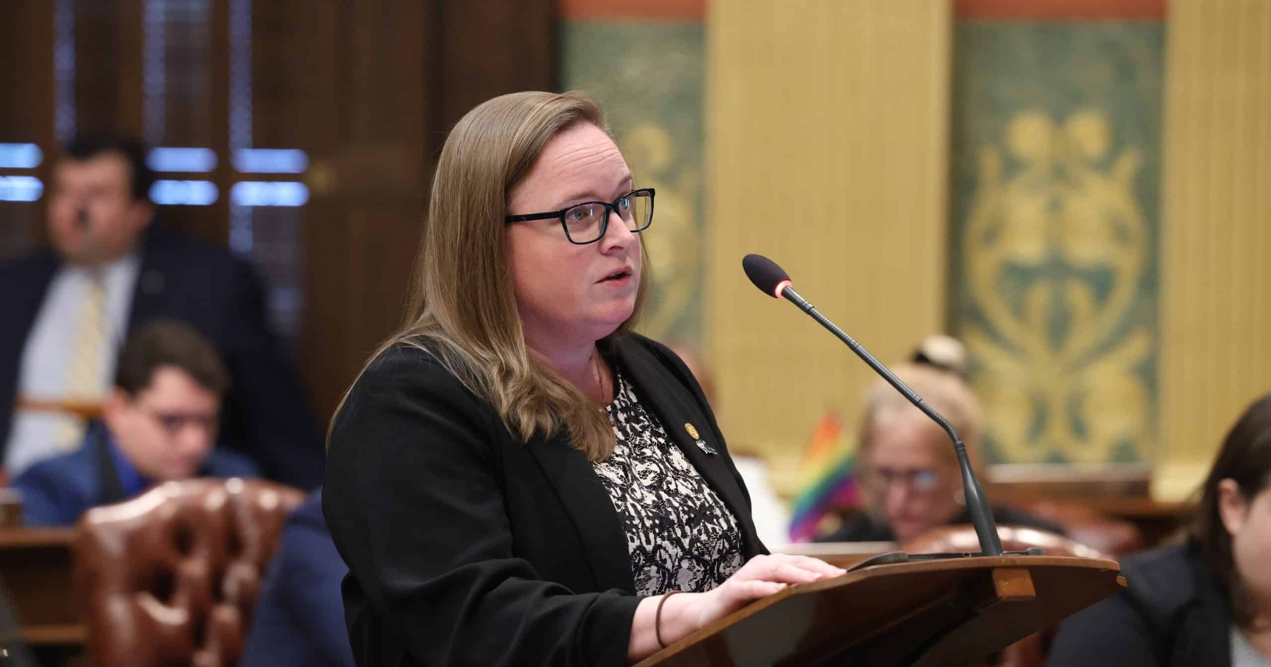 State Representative Kelly Breen speaking on the House floor in the Michigan Capitol Building.