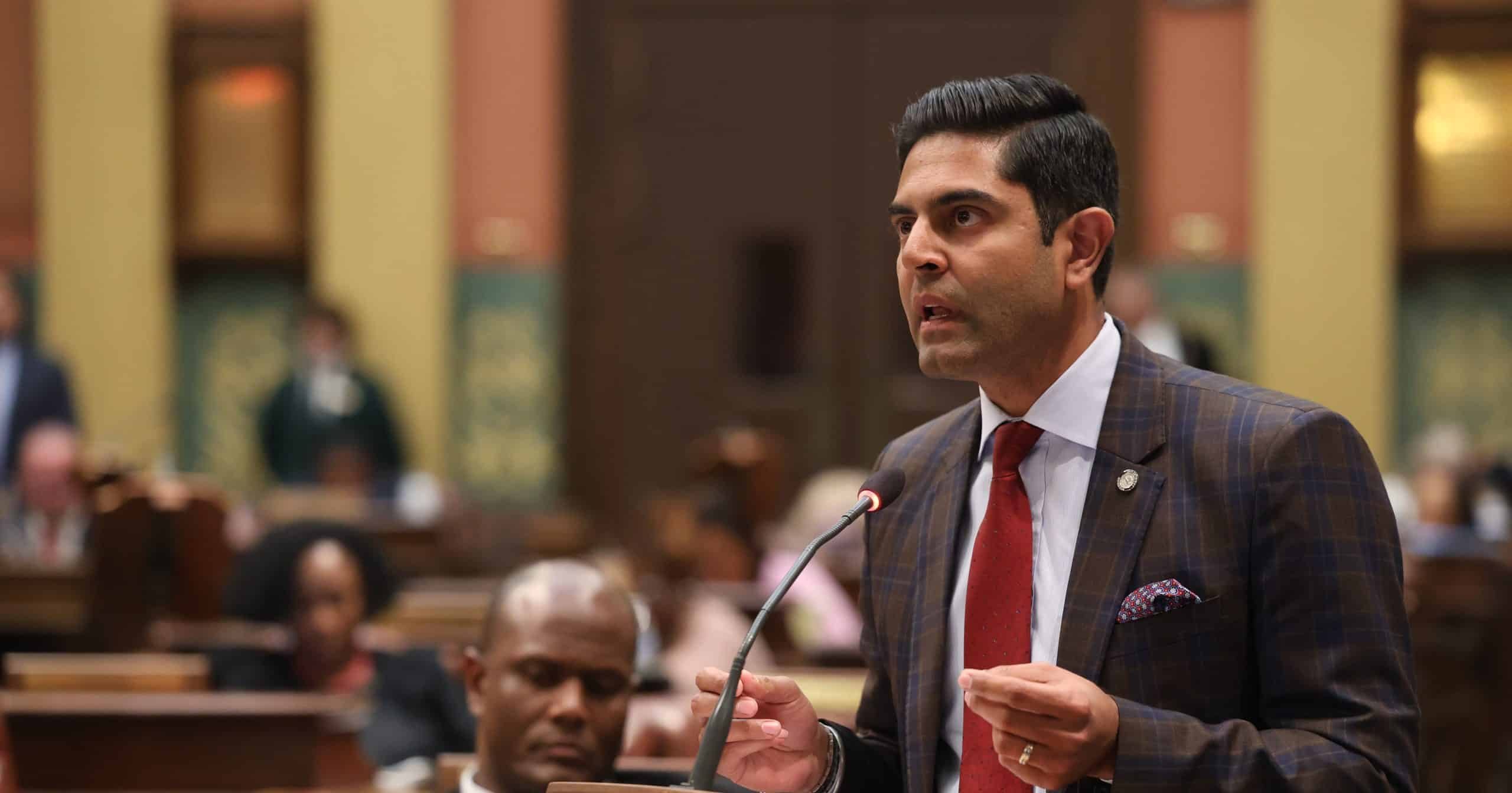 House Democratic Leader Ranjeev Puri speaking on the House floor in the Michigan Capitol Building.