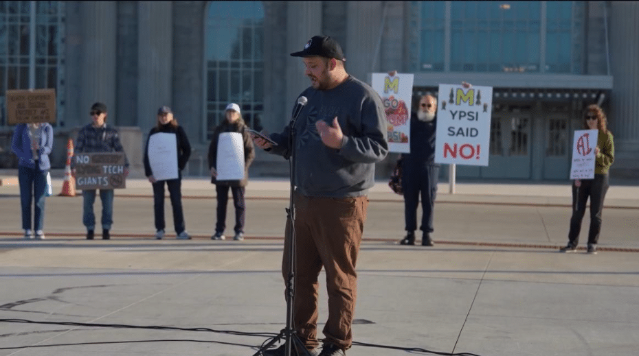 state Rep. Dylan Wegela speaks at the anti-data center rally